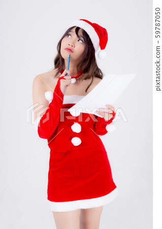 Beautiful portrait young asian woman thinking and writing notepad in xmas day isolated 59787050