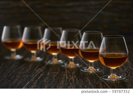 six glasses of congac on a black background, six glasses of congac on a black background, 59787352