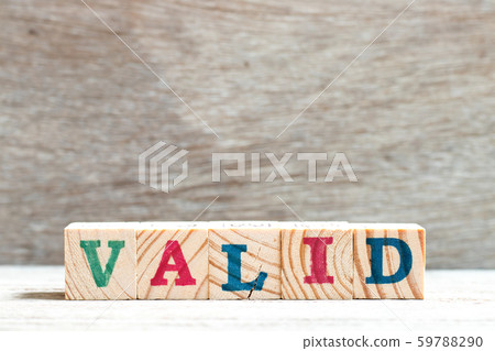 Letter block in word valid on wood background 59788290