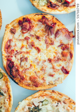 Pizza with Mozzarella cheese, sausage, Tomato sauce, Spices and peppers, bacon, vertical photo Pizza with Mozzarella cheese, sausage, Tomato sauce, Spices and peppers, bacon, vertical photo 59788749