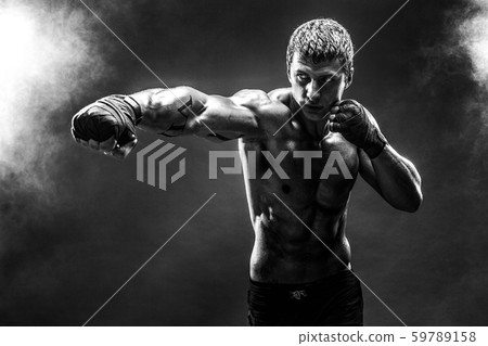 Handsome topless sportsman practicing punches 59789158