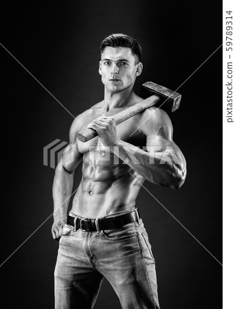 Muscular man with naked torso holding big hummer. Isolated on dark grey background 59789314