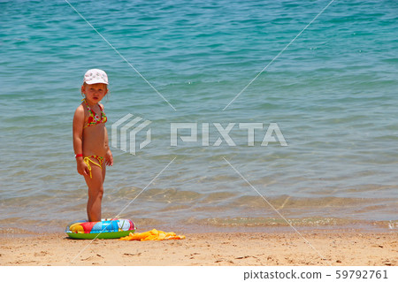Little girl with inflatable circle on summer 59792761