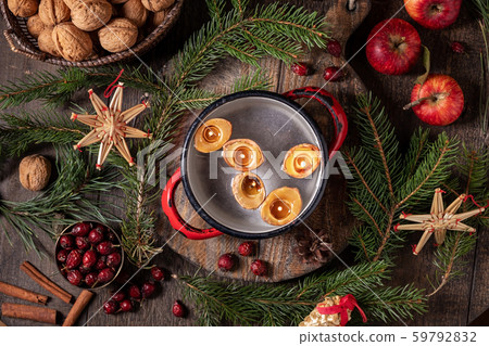 Candles made from nutshells floating on water Candles made from nutshells floating on water 59792832