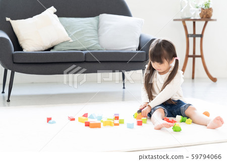 Girl playing with building blocks 59794066