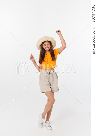 Cool hipster portrait of young stylish teen girl showing her hands up, positive mood and emotions Cool hipster portrait of young stylish teen girl showing her hands up, positive mood and emotions 59794730