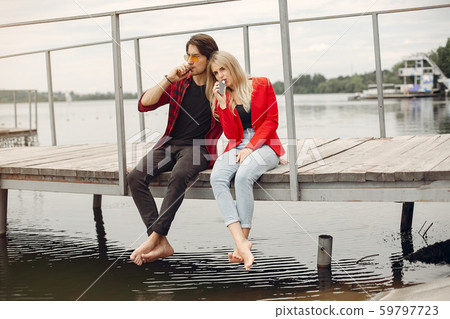 Stylish young couple with vape in a city 59797723