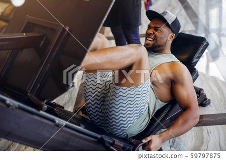 A handsome black man is engaged in a gym A handsome black man is engaged in a gym 59797875