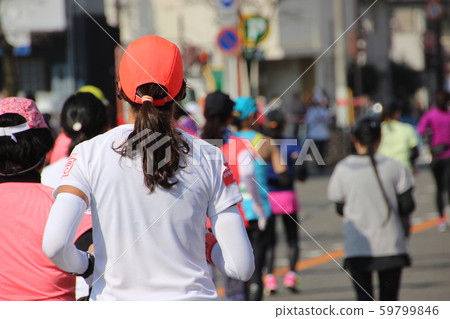 Female runner at marathon 59799846