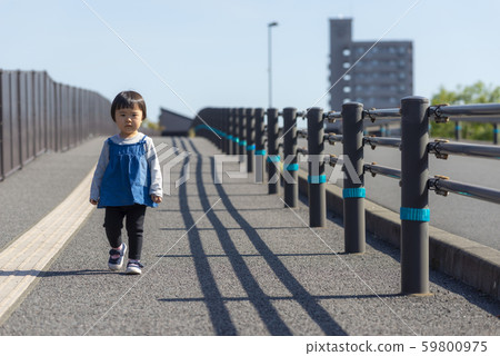 2-year-old child walking alone 2-year-old child walking alone 59800975