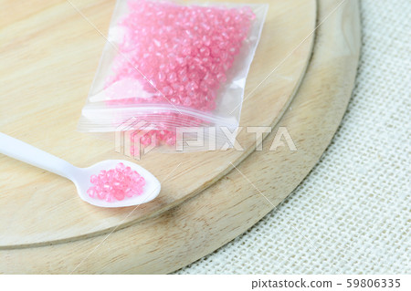 Colorful beads on a wooden surface. Various of Colorful beads on a wooden surface. Various of 59806335