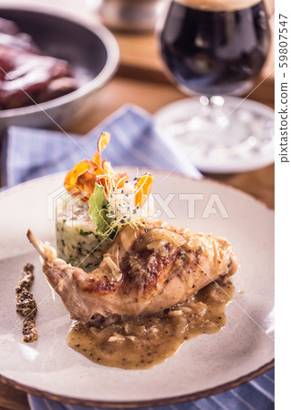 Rabbit leg with mashes potatoes and decoration on Rabbit leg with mashes potatoes and decoration on 59807547