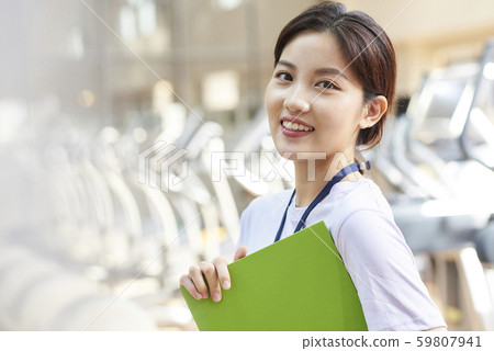 Female sports gym staff Female sports gym staff 59807941
