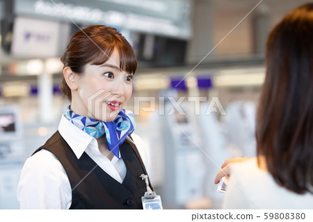 Airport ground staff guiding 59808380