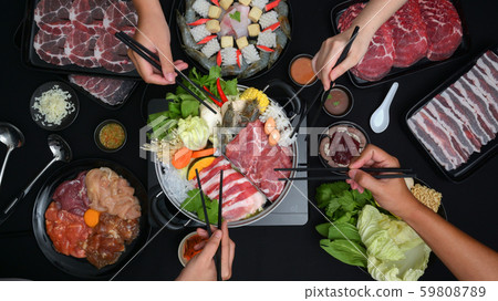 Top view of people eating Shabu-Shabu in hot pot Top view of people eating Shabu-Shabu in hot pot 59808789