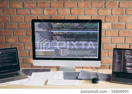 Computer of the software developer on the desk in 59809095