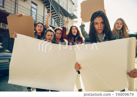 Young people protesting of women rights and equality on the street Young people protesting of women rights and equality on the street 59809679