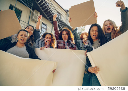 Young people protesting of women rights and equality on the street Young people protesting of women rights and equality on the street 59809686