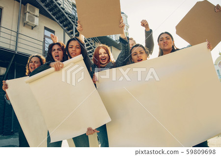 Young people protesting of women rights and equality on the street Young people protesting of women rights and equality on the street 59809698