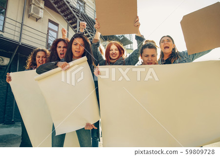 Young people protesting of women rights and equality on the street Young people protesting of women rights and equality on the street 59809728