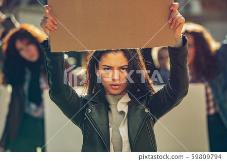 Young people protesting of women rights and equality on the street 59809794