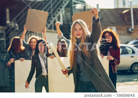 Young people protesting of women rights and equality on the street Young people protesting of women rights and equality on the street 59809848