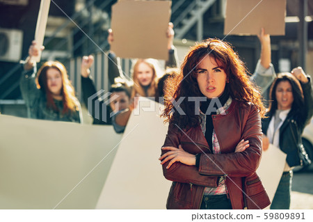Young people protesting of women rights and equality on the street Young people protesting of women rights and equality on the street 59809891