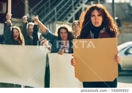Young people protesting of women rights and equality on the street Young people protesting of women rights and equality on the street 59809892