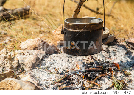 Bowler hat over a campfire in the fall Bowler hat over a campfire in the fall 59811477