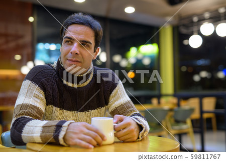 Man drinking coffee in coffee shop Man drinking coffee in coffee shop 59811767