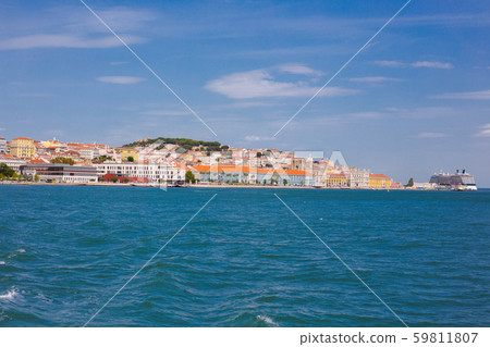 Lisbon on the Tagus river bank, central Portugal. Tajo view from the ferry to Almada. Lisbon on the Tagus river bank, central Portugal. Tajo view from the ferry to Almada. 59811807