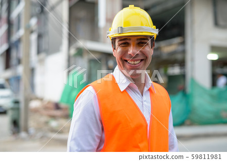 Handsome Persian man construction worker at the construction sit Handsome Persian man construction worker at the construction sit 59811981