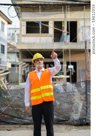 Handsome Persian man construction worker at the construction sit 59812059