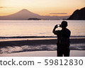 A person taking a sunset 59812830