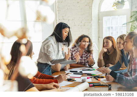 Young people discussing about women rights and equality at the office Young people discussing about women rights and equality at the office 59813108