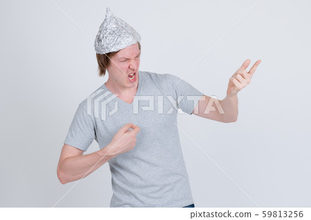 Young man with tin foil hat with air guitar gesture Young man with tin foil hat with air guitar gesture 59813256
