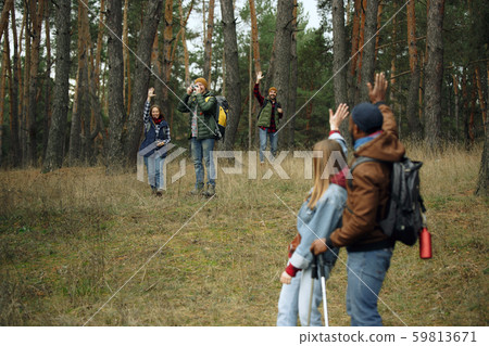 Group of friends on a camping or hiking trip in autumn day Group of friends on a camping or hiking trip in autumn day 59813671