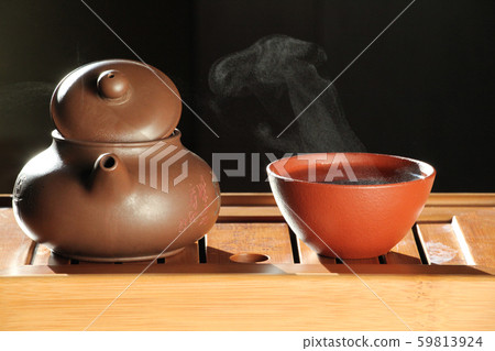 hot tea cup dark background   59813924