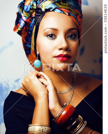 beauty bright african woman with creative make up, shawl on head like cubian closeup smiling beauty bright african woman with creative make up, shawl on head like cubian closeup smiling 59814639