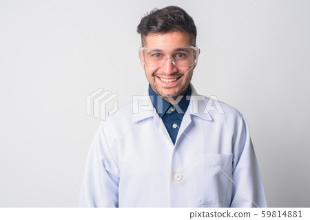 Face of happy Persian man doctor as scientist smiling Face of happy Persian man doctor as scientist smiling 59814881