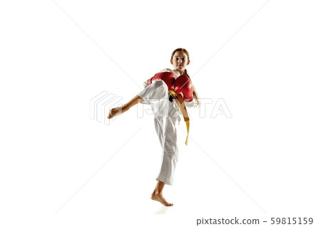 Confident junior in kimono practicing hand-to-hand combat, martial arts Confident junior in kimono practicing hand-to-hand combat, martial arts 59815159