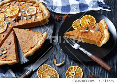 sliced Sweet potato pie decorated with orange sliced Sweet potato pie decorated with orange 59815729