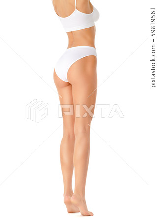 Slim woman's legs isolated on white background Slim woman's legs isolated on white background 59819561