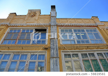 Old yellow brick industrial building 59819581