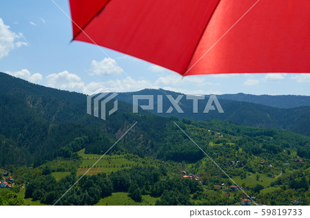 Umbrella and a countryside 59819733