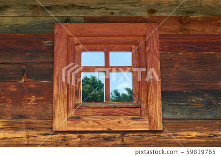 Window of a wooden cottage 59819765