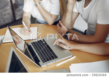 Young team working together and use the laptop Young team working together and use the laptop 59820369