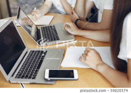 Young team working together and use the laptop Young team working together and use the laptop 59820374