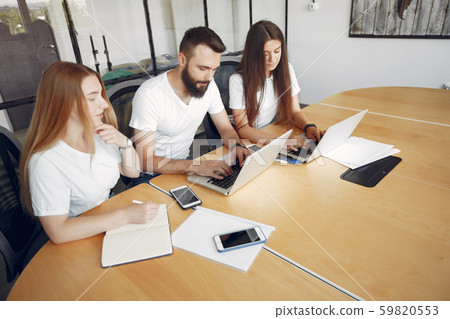 Young team working together and use the laptop Young team working together and use the laptop 59820553
