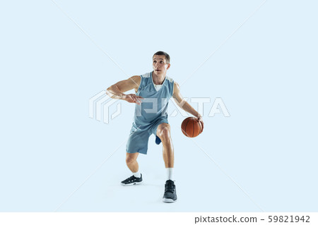 Young caucasian basketball player against white studio background Young caucasian basketball player against white studio background 59821942